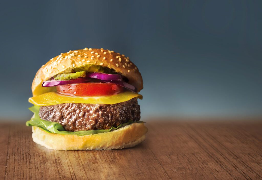 A photograph of a hamburger made with cultured meat, grown in a lab by food tech company Mosa Meat